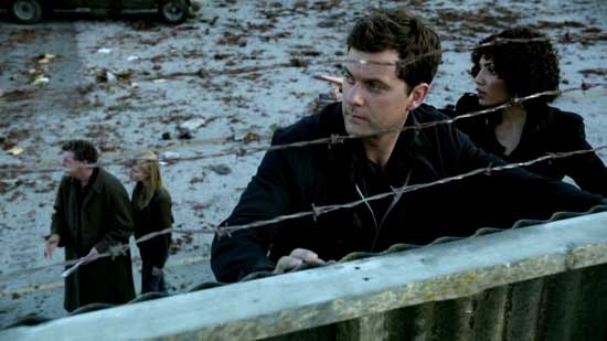 Peter and Astrid look over the fence